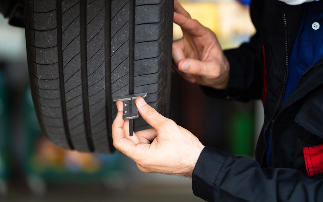 measure tread depth, spot uneven wear, Check Tire Tread